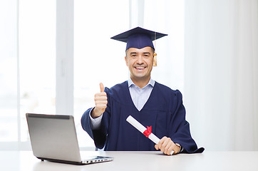 Image showing smiling adult student in mortarboard with diploma