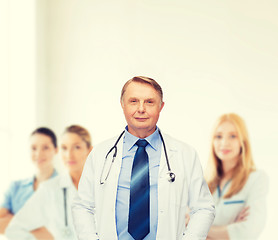 Image showing smiling doctor or professor with stethoscope