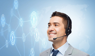 Image showing smiling businessman in headset