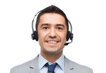 Image showing smiling businessman in headset