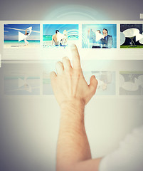 Image showing man pressing button on virtual screen