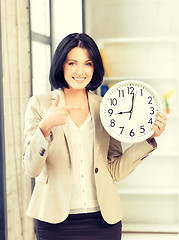 Image showing businesswoman with clock