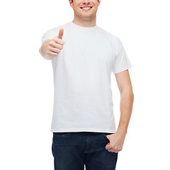 Image showing smiling man in white t-shirt showing thumbs up