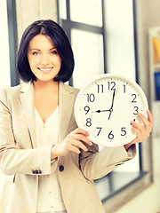 Image showing businesswoman with clock