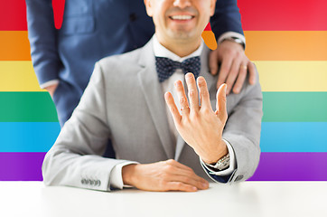 Image showing close up of male gay couple with wedding rings on