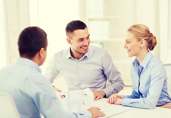 Image showing couple looking at model of their house at office