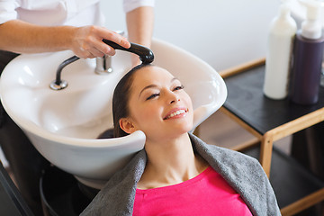 Image showing happy young woman at hair salon