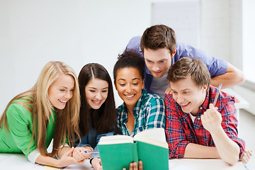 Image showing students reading book at school