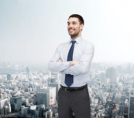 Image showing handsome businessman with crossed arms