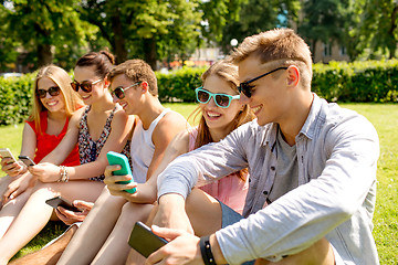 Image showing smiling friends with smartphone making selfie