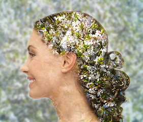 Image showing happy woman face over blooming tree pattern