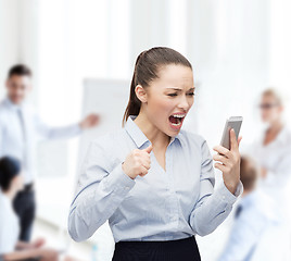 Image showing screaming businesswoman with smartphone