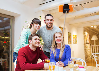 Image showing group of friends taking selfie with smartphone