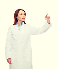 Image showing doctor pointing to something or pressing button