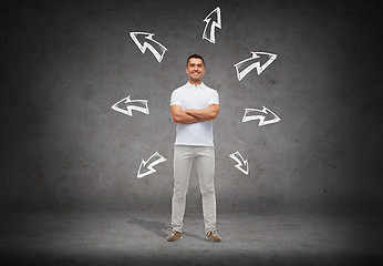 Image showing smiling man over arrow doodles background