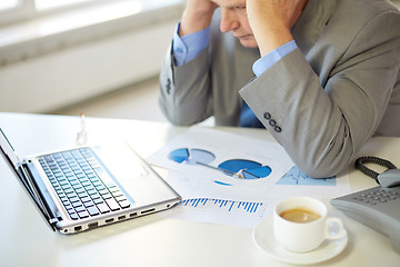 Image showing close up of stressed old man with laptop in office