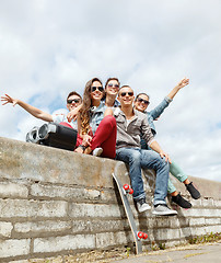 Image showing group of smiling teenagers hanging out