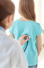 Image showing close up of girl and doctor on medical exam