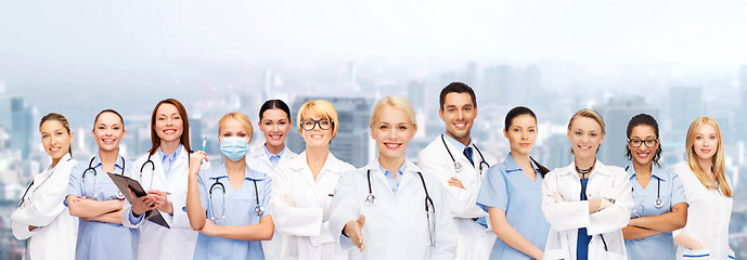 Image showing smiling female doctors and nurses with stethoscope