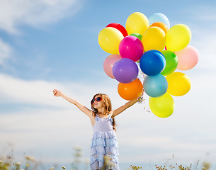 Image showing happy girl with colorful balloons