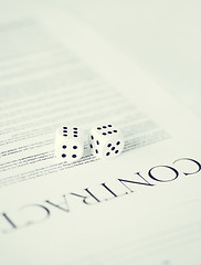 Image showing contract paper with gambling dices