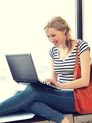 Image showing happy teenage girl with laptop computer