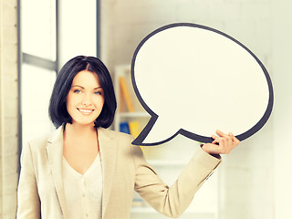 Image showing smiling businesswoman with blank text bubble