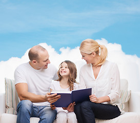 Image showing happy family with book at home