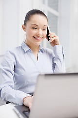 Image showing smiling businesswoman with laptop