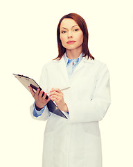 Image showing smiling female doctor with clipboard