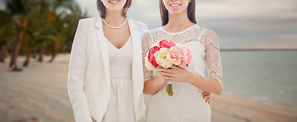 Image showing close up of happy lesbian couple with flowers