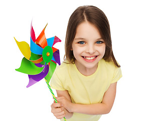 Image showing smiling child with colorful windmill toy