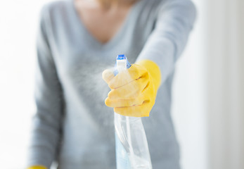 Image showing close up of happy woman with cleanser spraying