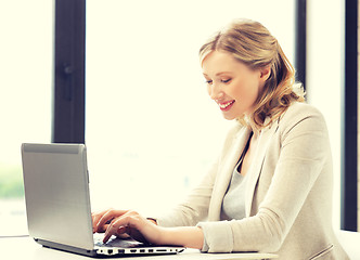 Image showing happy woman with laptop computer