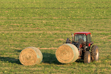 Image showing farmer and hay bales