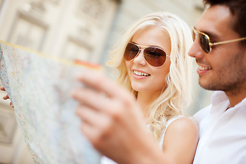 Image showing couple with map in the city