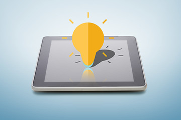 Image showing tablet pc with lightning bulb icon over screen