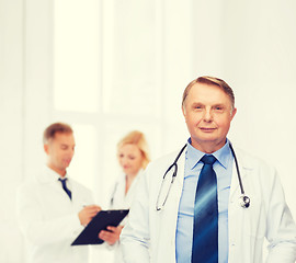 Image showing smiling doctor or professor with stethoscope