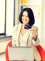 Image showing happy woman with laptop computer and credit card