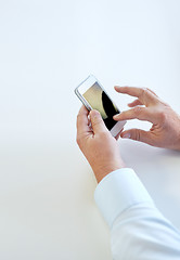 Image showing close up of senior man hands with smartphone,