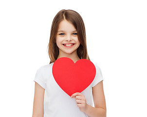 Image showing smiling little girl with red heart