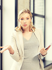 Image showing worried woman with documents