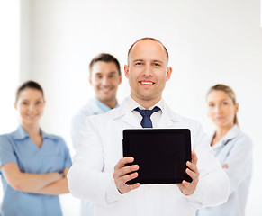 Image showing smiling male doctor with tablet pc