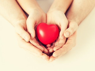 Image showing woman and man hands with heart