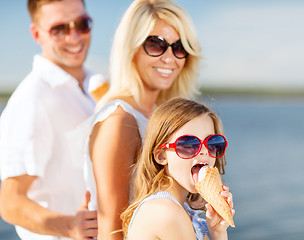 Image showing happy family eating ice cream