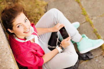 Image showing girl with headphones listening to music