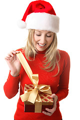 Image showing Female opening a present