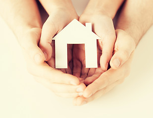 Image showing woman and hands with paper house