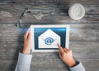 Image showing close up of hands with tablet pc and e-mail