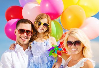 Image showing family with colorful balloons